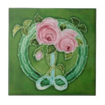 Pink Roses Majolica Faux Relief Repro Antique Tile<br><div class="desc">Pretty pink roses with aqua blue ribbons and wreath against a green background make this reproduction c. 1900 art nouveau Richards tile a standout. Can be used as a wall or backsplash tile for kitchen, laundry, bath, or shower. Personalise for useful, unique wedding favours or gifts. Available in 4.5 and...</div>