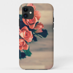 Pink Roses on a wooden food. iPhone 11 Case