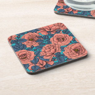 Pink roses with blue leaves on blue coaster
