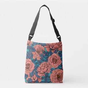 Pink roses with blue leaves on blue crossbody bag