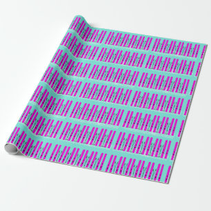 Pink skis on blue wrapping paper