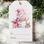 Pink Snowman Cute Watercolor To and From Christmas Gift Tags<br><div class="desc">These Christmas gift tags feature a chic watercolor snowman with presents on each side. The snowman is wearing a hat and scarf and is accented with green pine branches. Simply write in the names in the to and from area. Attach to presents, gift bags, bottles of wine, and more for...</div>