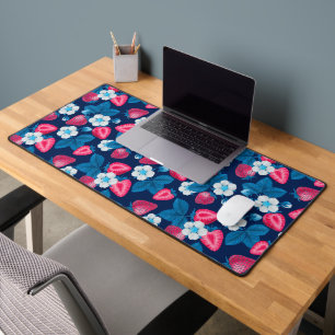 Pink strawberries on blue desk mat