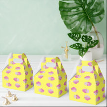 Pink strawberry cupcakes on yellow