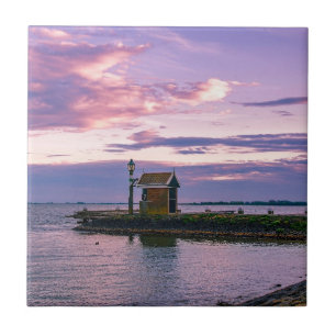 Pink sunset over lake tile