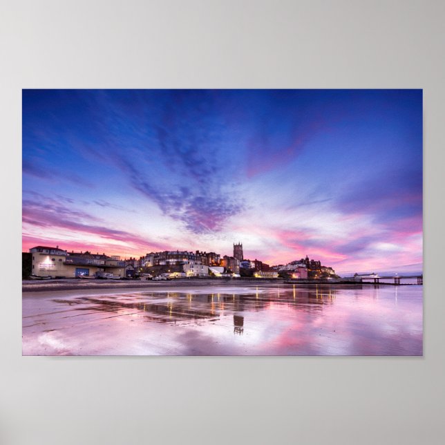 Pink sunset reflections over Cromer town at dusk Poster (Front)