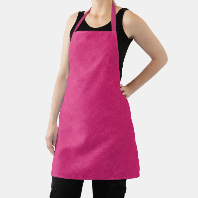 Pink textured surface with subtle swirling pattern apron (Insitu)