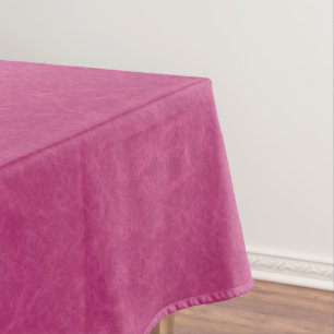 Pink textured surface with swirling pattern tablecloth