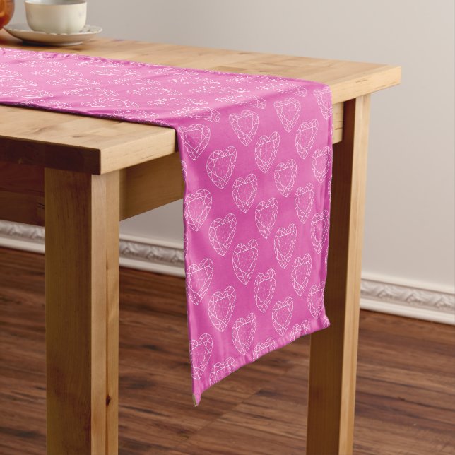 Pink tourmaline gem hearts on white table runner (In Situ)