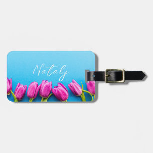 Pink tulips on a blue background luggage tag