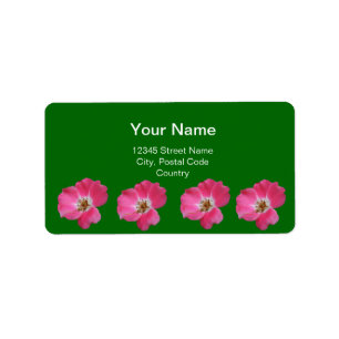pink wild rose flowers in green label