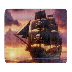 Pirate ship at sunrise/sunset cutting board