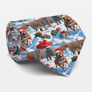Pitbull Dog Running in Snow with Christmas Hat Tie