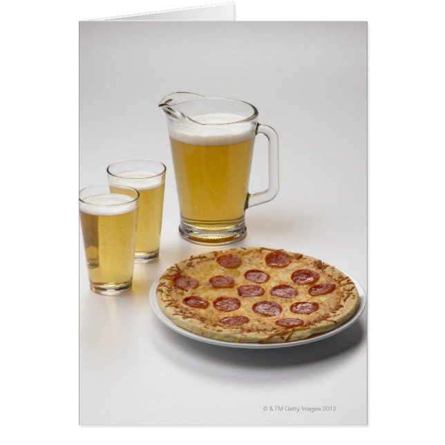 Pitcher and two pints of beer beside pepperoni (Front)