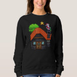 Pixel Art Santa on Rooftop Christmas House Scene Sweatshirt<br><div class="desc">Festive pixel art of Santa Claus standing on a snowy rooftop holding a tree,  beside a cosy brick house under a glowing star – perfect holiday vibes!</div>