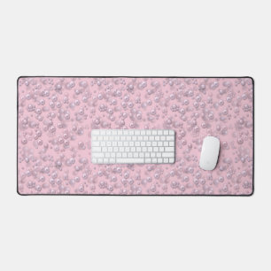 Placers of white-pink pearls on pink velvet desk mat
