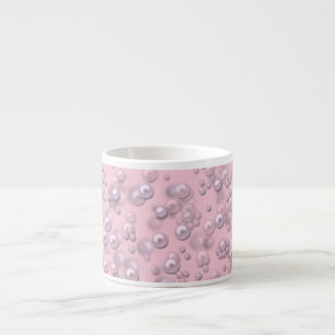 Placers of white-pink pearls on pink velvet espresso cup