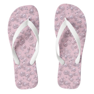 Placers of white-pink pearls on pink velvet flip flops