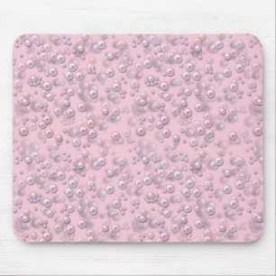 Placers of white-pink pearls on pink velvet mouse mat