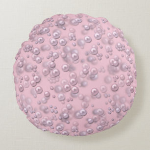 Placers of white-pink pearls on pink velvet round cushion