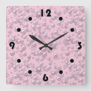 Placers of white-pink pearls on pink velvet square wall clock