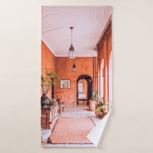 PLANTERS WITH PLANT NEAR AREA RUG INSIDE ROOM BATH TOWEL
