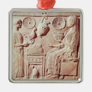 Plaque of a woman offering gifts to a seated metal tree decoration