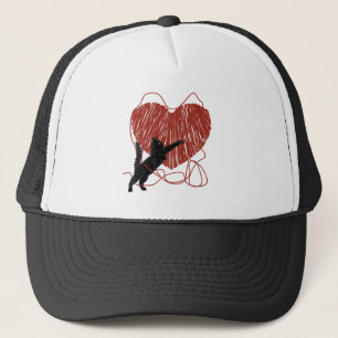 Playful Black Cat Unraveling Red Heart Trucker Hat