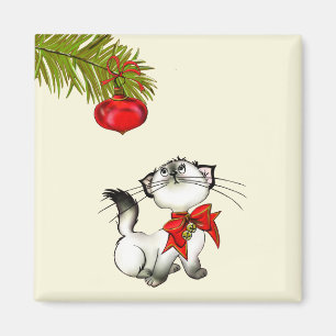 Playful Christmas Kitty With A Red Bow Magnet