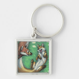 Playful foxes key ring