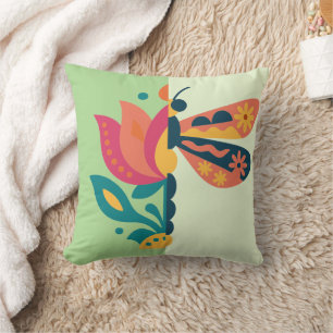 Playful insect and flower graphic design cushion