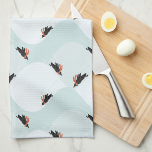 Playful Penguins Sliding on Snow Pattern Tea Towel