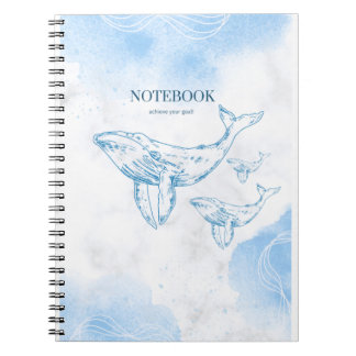 Playful whales in the ocean notebook