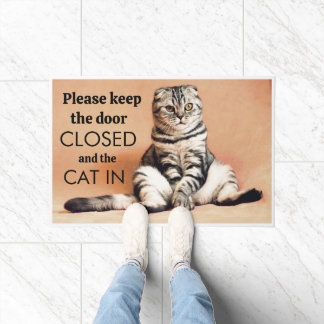  please keep the door closed and the cat(s) in  doormat