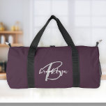 Plum Purple Grey White Script Monogram  Duffle Bag<br><div class="desc">This personalised duffel bag features a monogram and first name in modern grey and white script on a stylish plum purple background.</div>