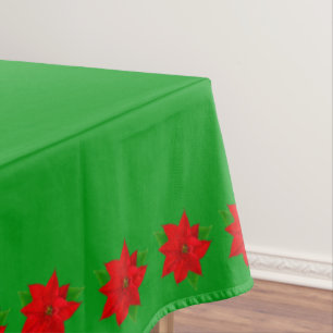 Poinsettia Flowers on Green Tablecloth