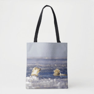 Polar bear cubs playing tote bag