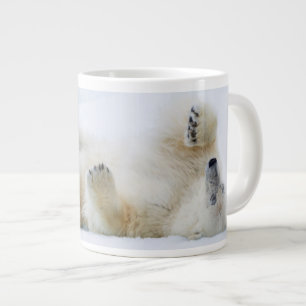 Polar bear rolling in snow, Norway Large Coffee Mug