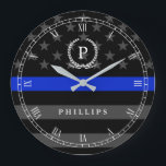 Police Styled American Flag Monogram Large Clock<br><div class="desc">A wall clock featuring a thin blue line American flag symbolic of law-enforcement.  Roman numerals and a spot for yours or your gift recipient's Monogram and last name.</div>