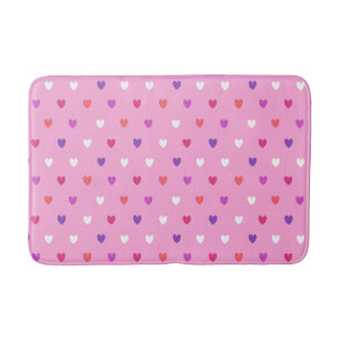 Polka hearts on pink bath mat