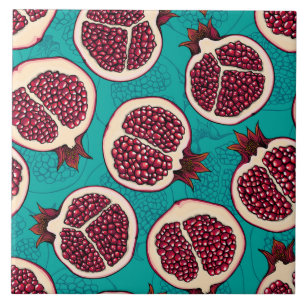 Pomegranate slices on turquoise tile