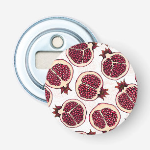Pomegranate slices on white bottle opener