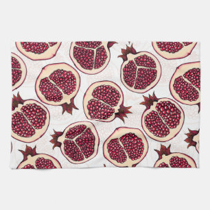 Pomegranate slices on white tea towel