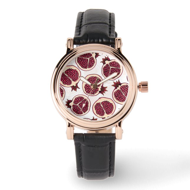 Pomegranate slices on white watch (Front)