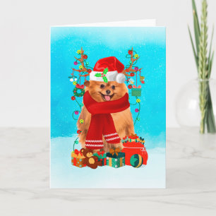 Pomeranian in snow with Christmas gifts  Card