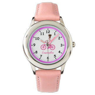 Pony-tailed Young Girl Riding a Pink Bicycle Watch