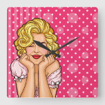 Pop Art Woman Dreaming Square Wall Clock<br><div class="desc">A vibrant clock design featuring a cheerful woman with voluminous blonde curls,  set 
against a playful pink polka dot background.  Her expression is one of joy and charm,  with hands resting on her cheeks.</div>