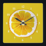 Pop art yellow lemon fruit original watercolour square wall clock<br><div class="desc">A cute and colourful vibrant yellow lemon fruit slice from an original painting by artist Sacha Grossel. This large pop art style fruit is yellow and very bright and colourful against a customisable yellow coloured background. Quirky and original.</div>