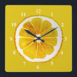 Pop art yellow lemon fruit original watercolour square wall clock<br><div class="desc">A cute and colourful vibrant yellow lemon fruit slice from an original painting by artist Sacha Grossel. This large pop art style fruit is yellow and very bright and colourful against a customisable yellow coloured background. Quirky and original.</div>
