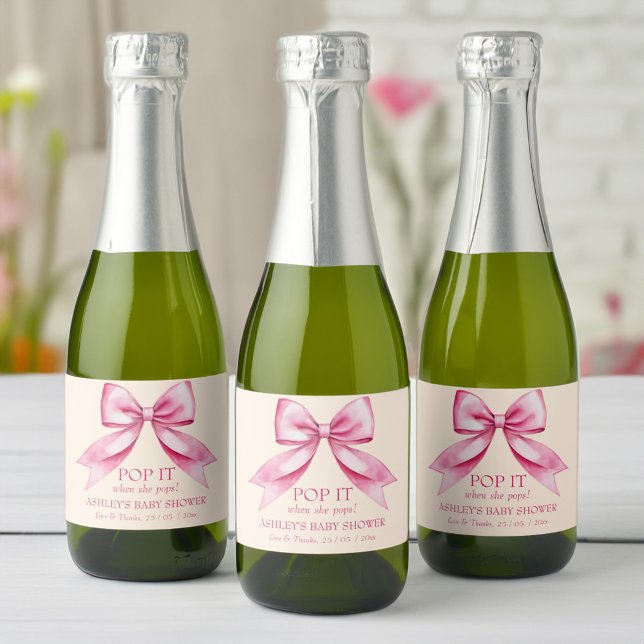 Pop it when she pops pink bow ribbon baby shower sparkling wine label (Pop it when she pops pink bow ribbon baby shower  favors sparkling wine label mini champagne labels)